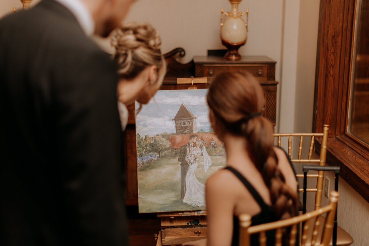 live-wedding-painting-of-couple-at-saint-clements-castle