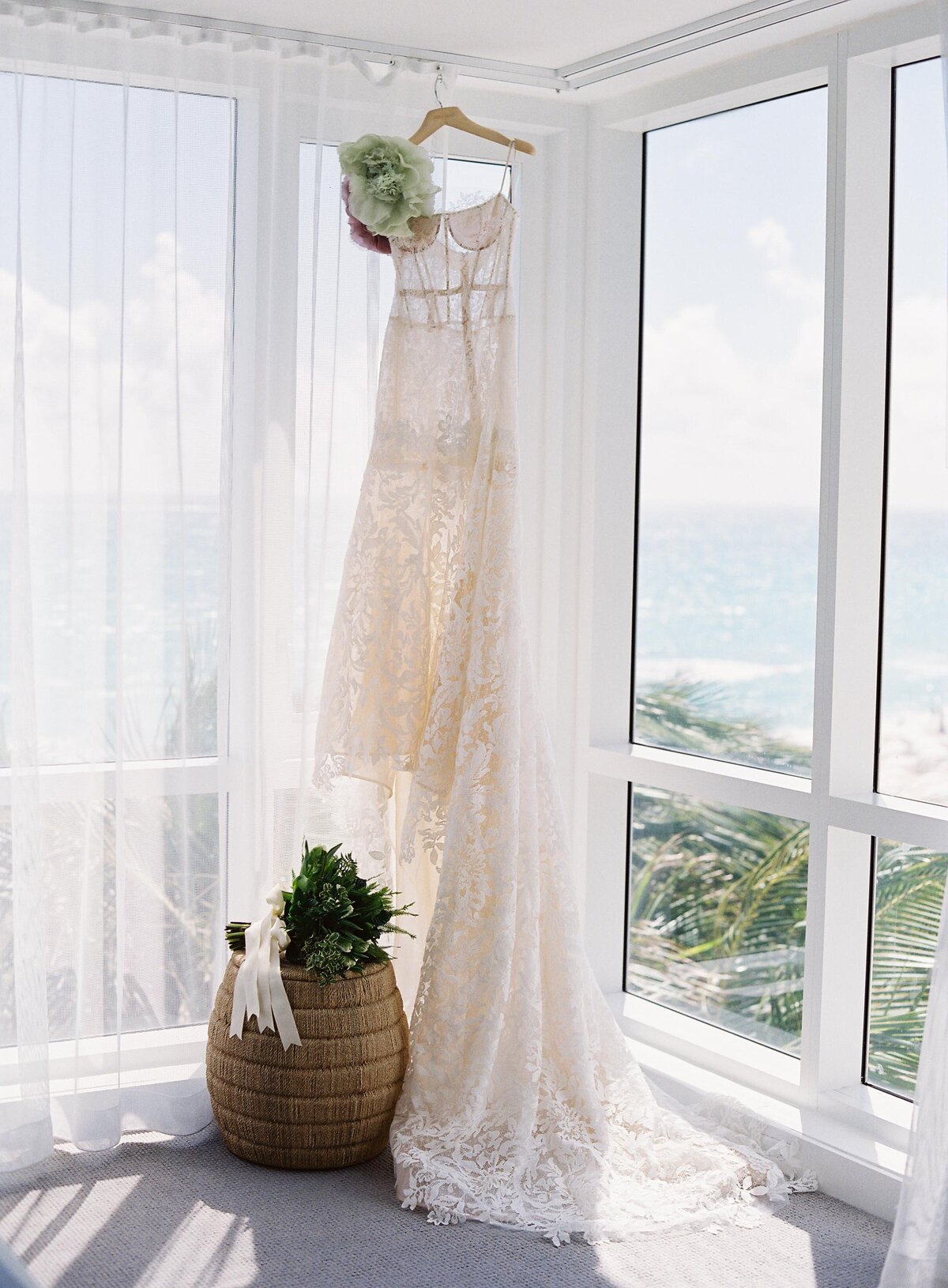 Wedding Gown Hanging by Window