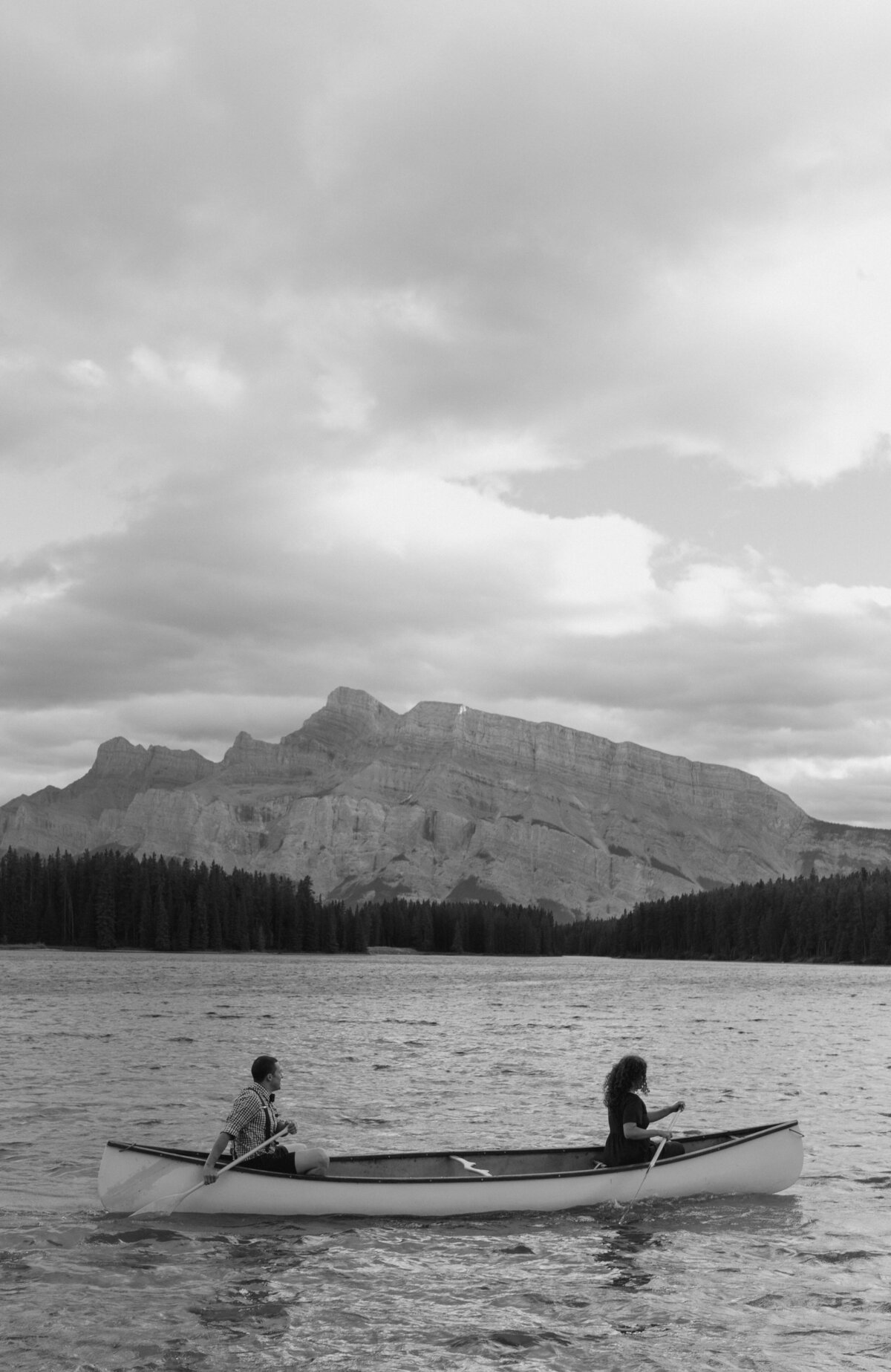 couple embarking on canoe at Two Jack Lake in Banff, Alberta