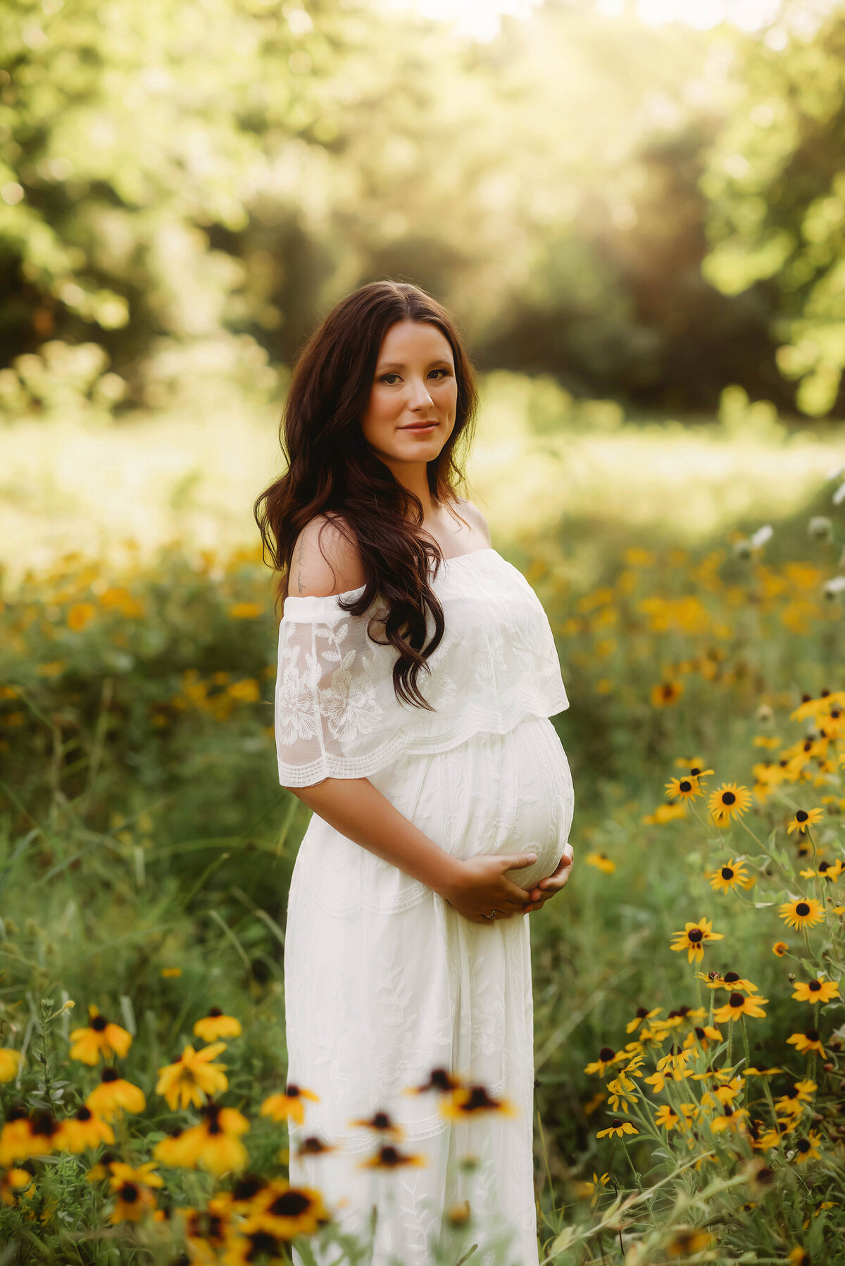 Pregnant woman poses for Maternity Photos in Charleston, SC.