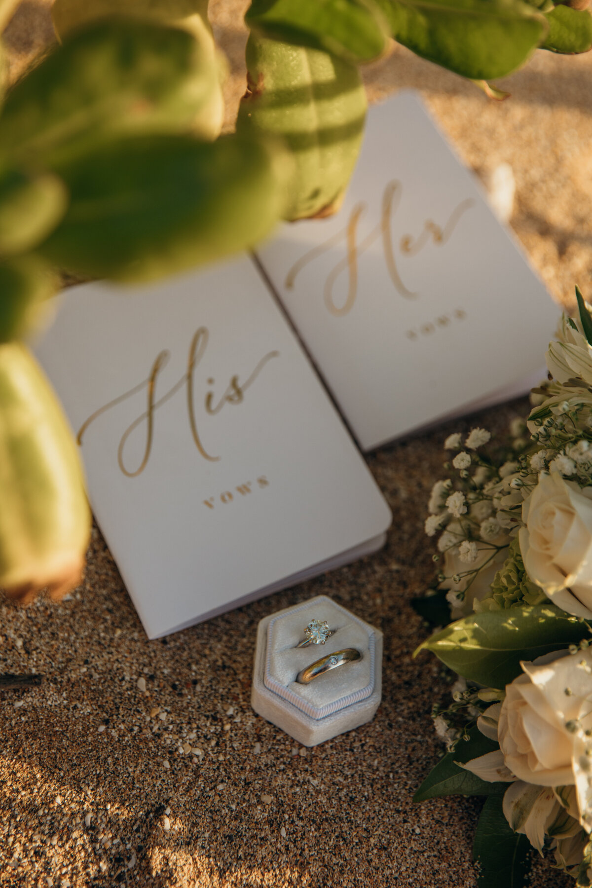 Maui Wedding Photographer captures vow books on beach with wedding rings