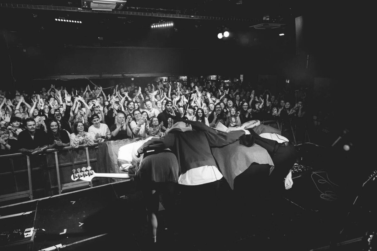 The aces on stage embracing together