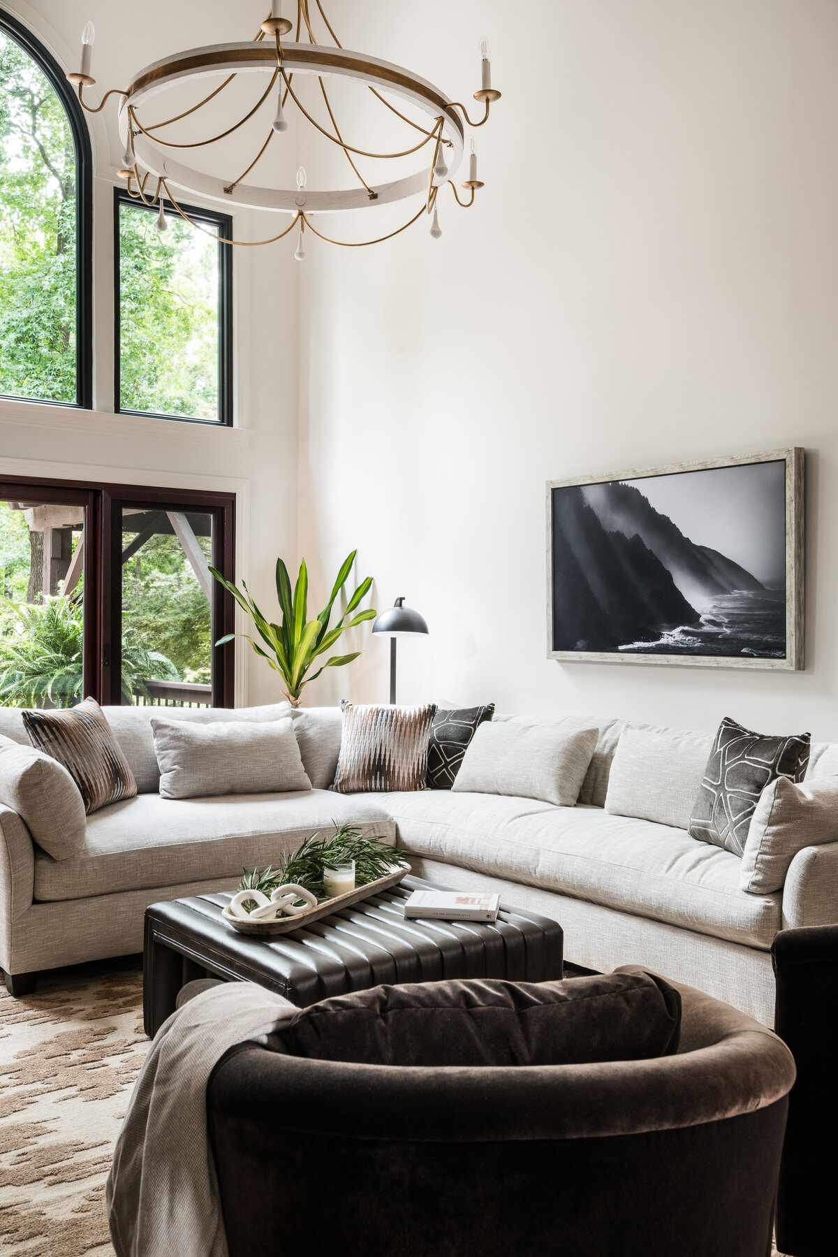 Cozy living room in Lake Norman, NC, with neutral furniture, a mounted TV, and modern decor.