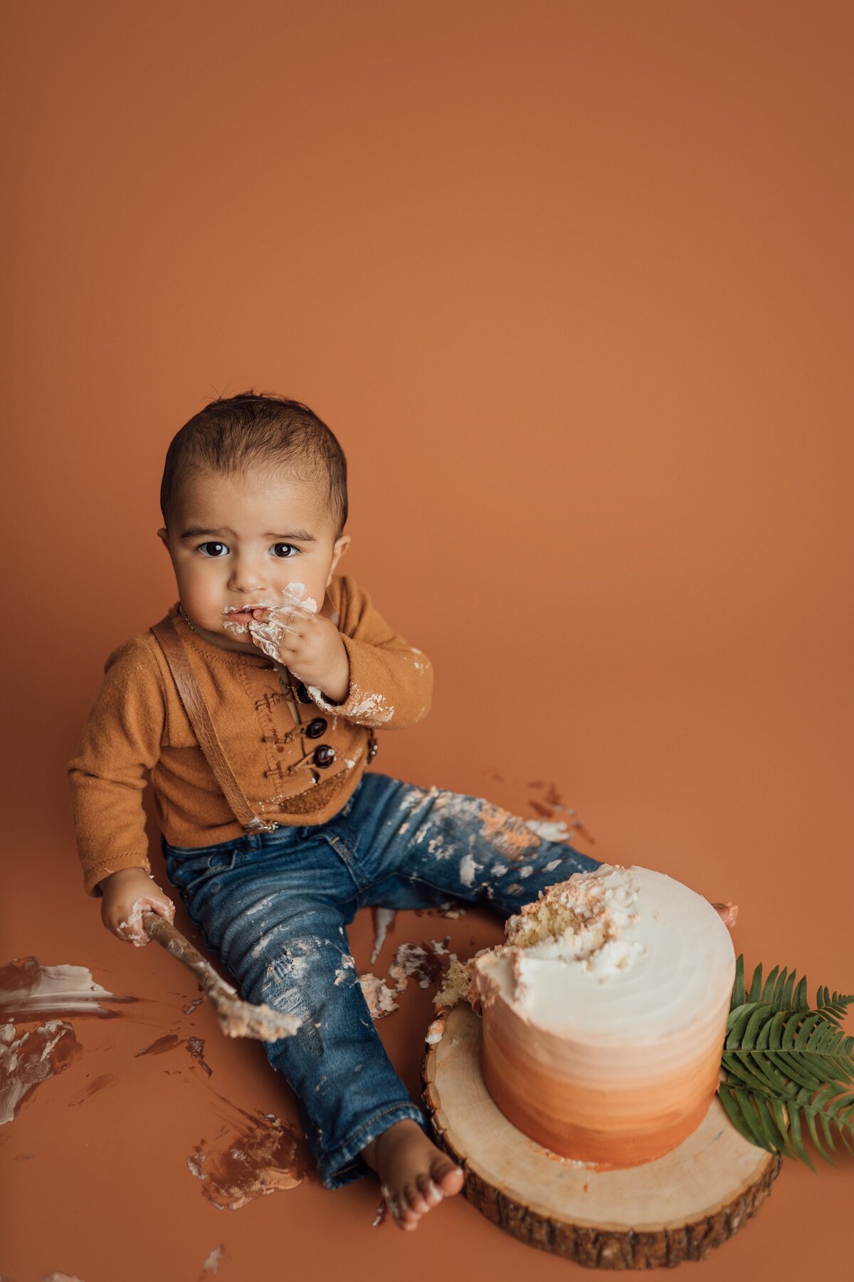 boy eating cake during photography session in tampa