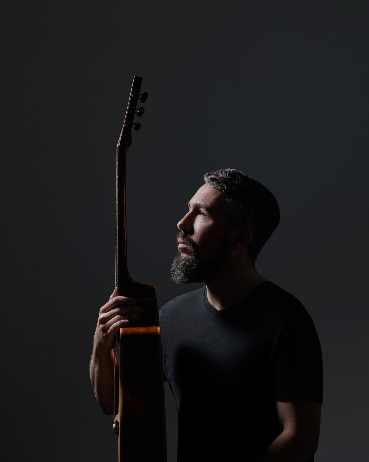 A man holding a guitar