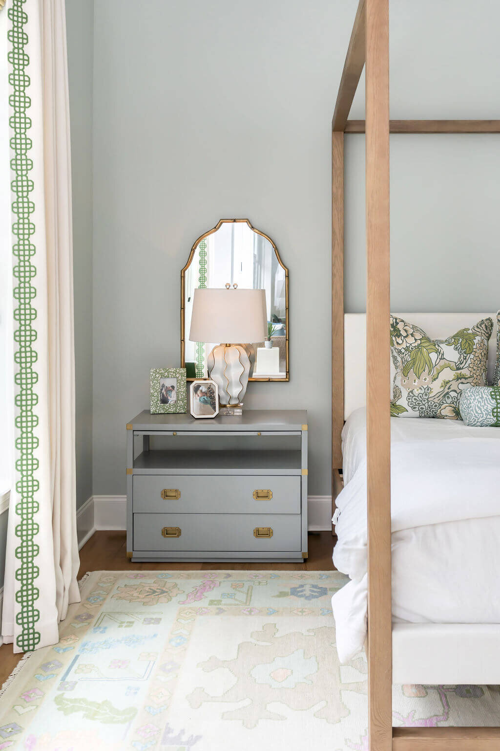 sweet southern home gracies space gray bedside table wooden canopy bed in bedroom