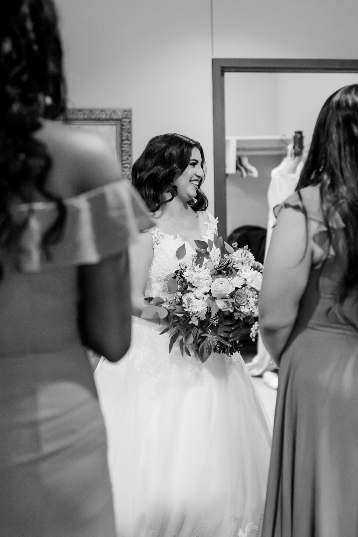 Capture the blissful moments of the bride getting ready with her girls at Anais Events Center in Bellaire, Texas, as they share laughter and love on this special day.