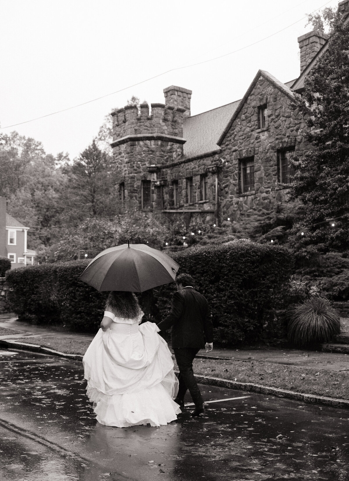 Romantic rainy-day wedding portraits at a castle in Asheville, North Carolina