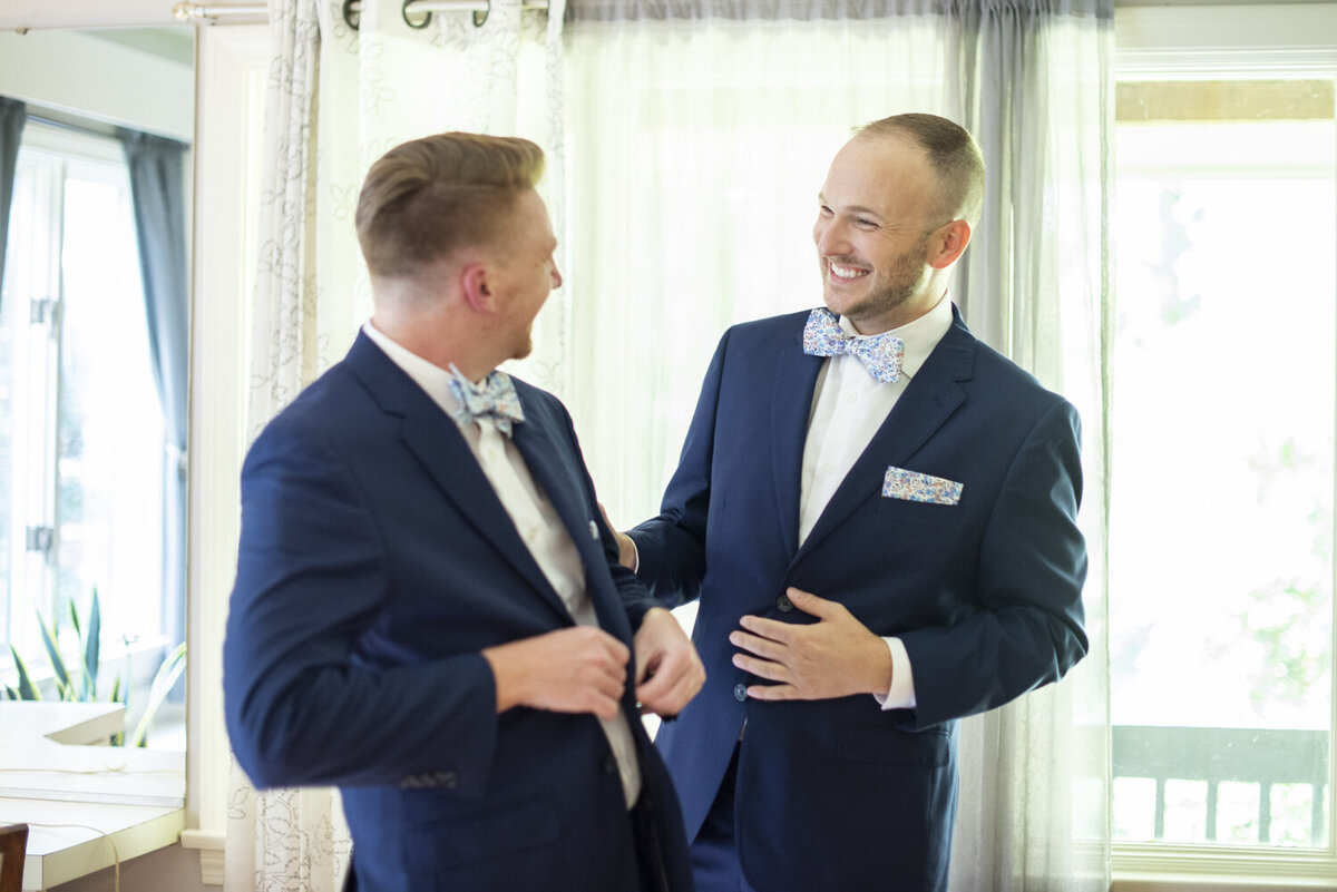Gay couple getting ready at wedding
