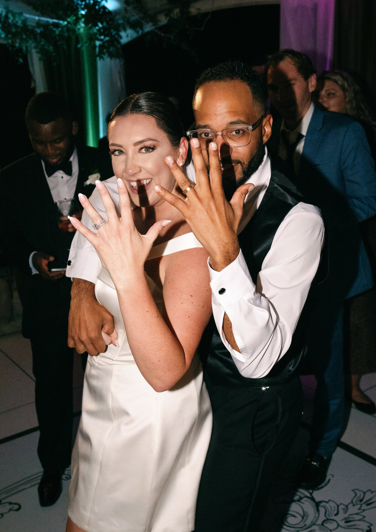 The bride and groom proudly show off their wedding rings during their Castle Ladyhawke reception.