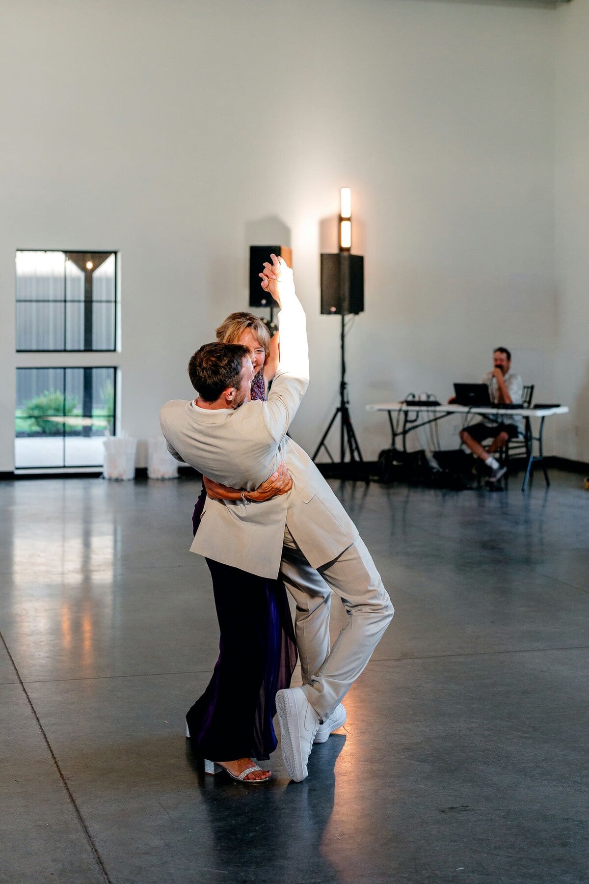 grooms-mother-dips-groom-on-stage