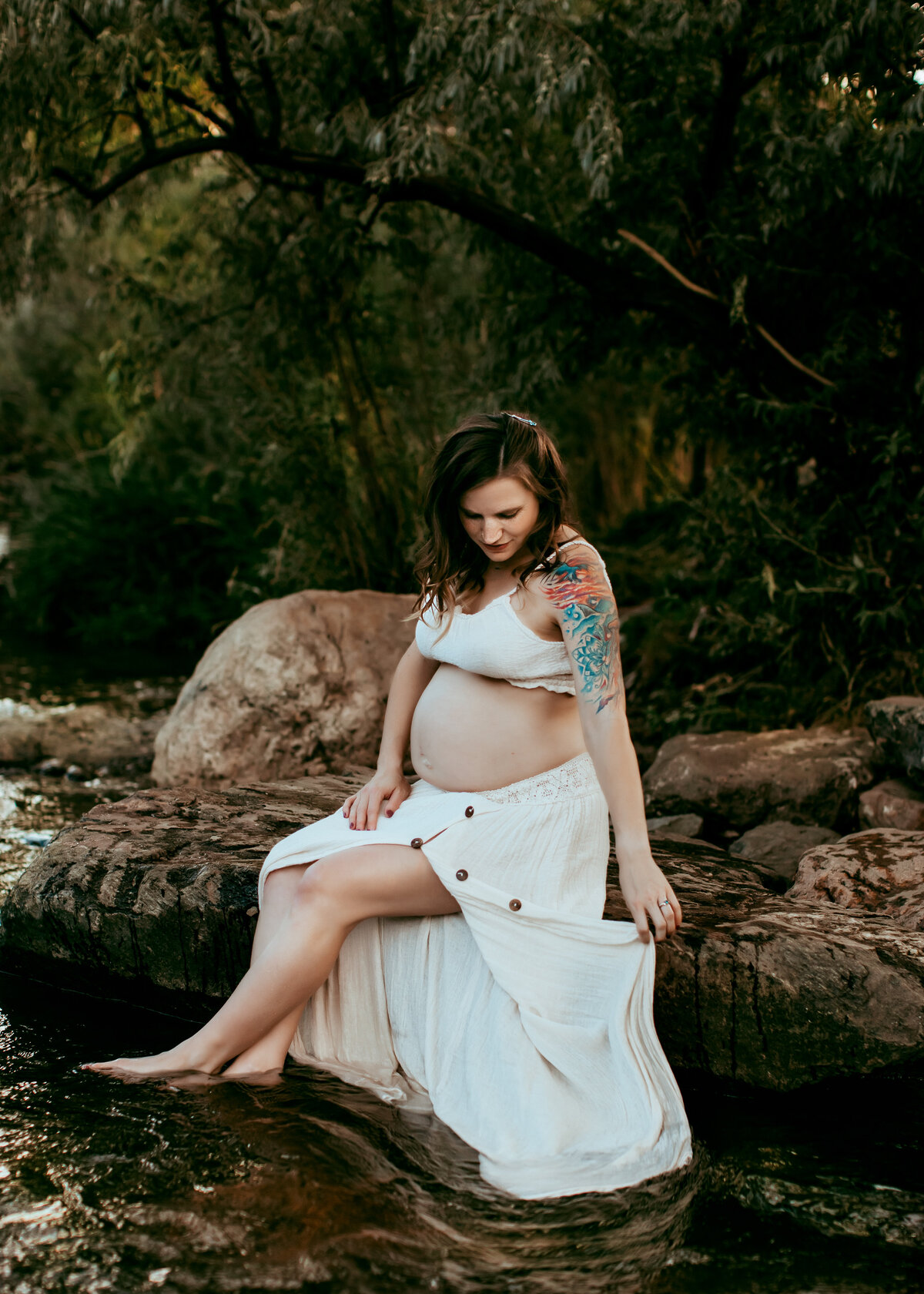 Pregnancy photoshoot in the water in Golden Colorado in the summer at sunset