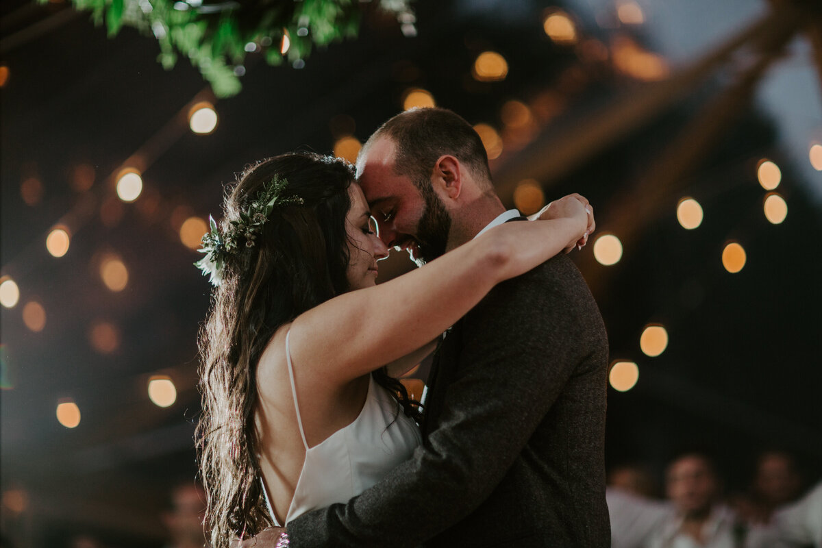 Newlyweds dance under twinkling lights
