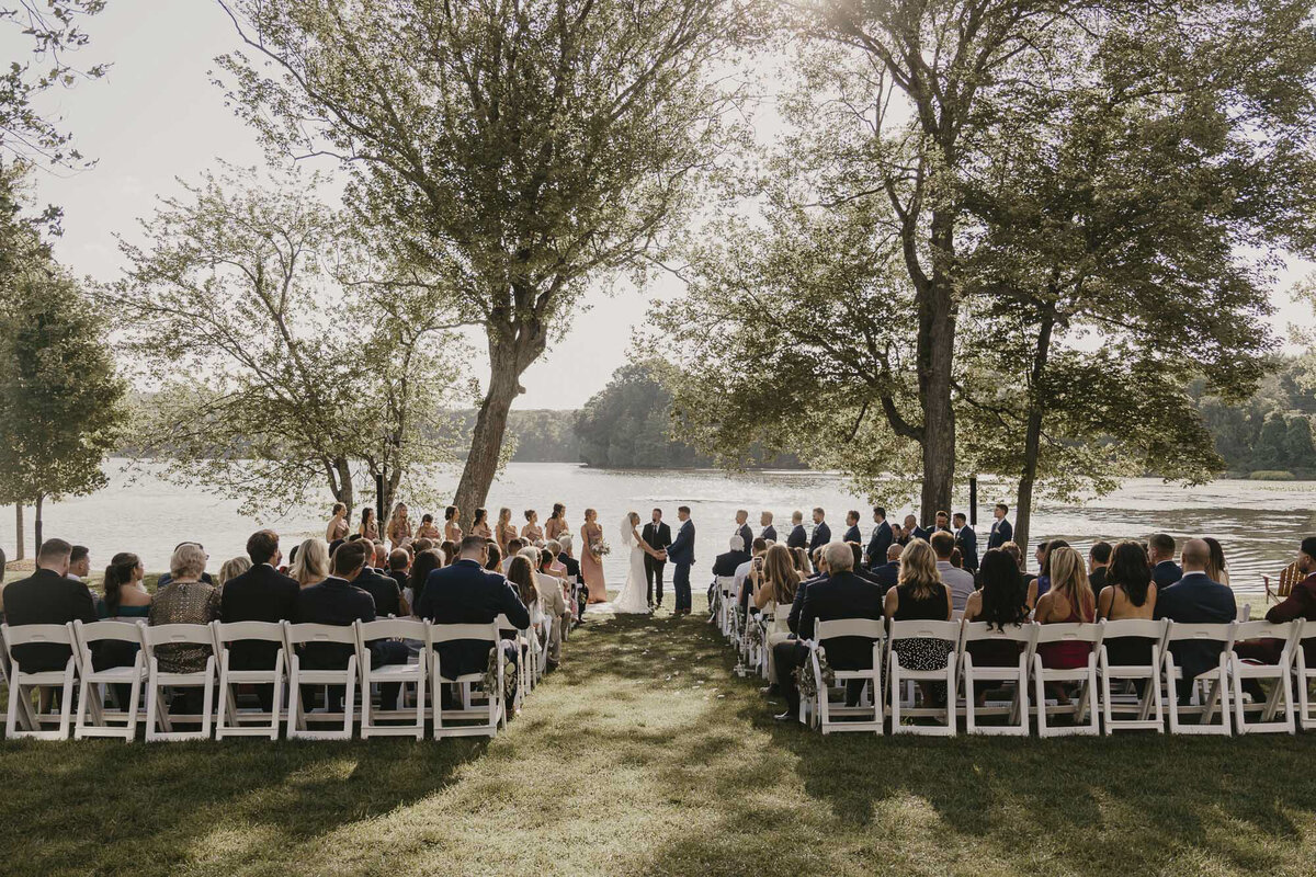 Wedding ceremony near a lake in the summer