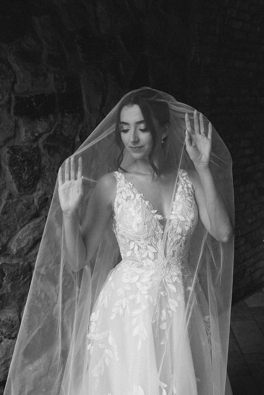 bride under veil at bella collina weddings & events​