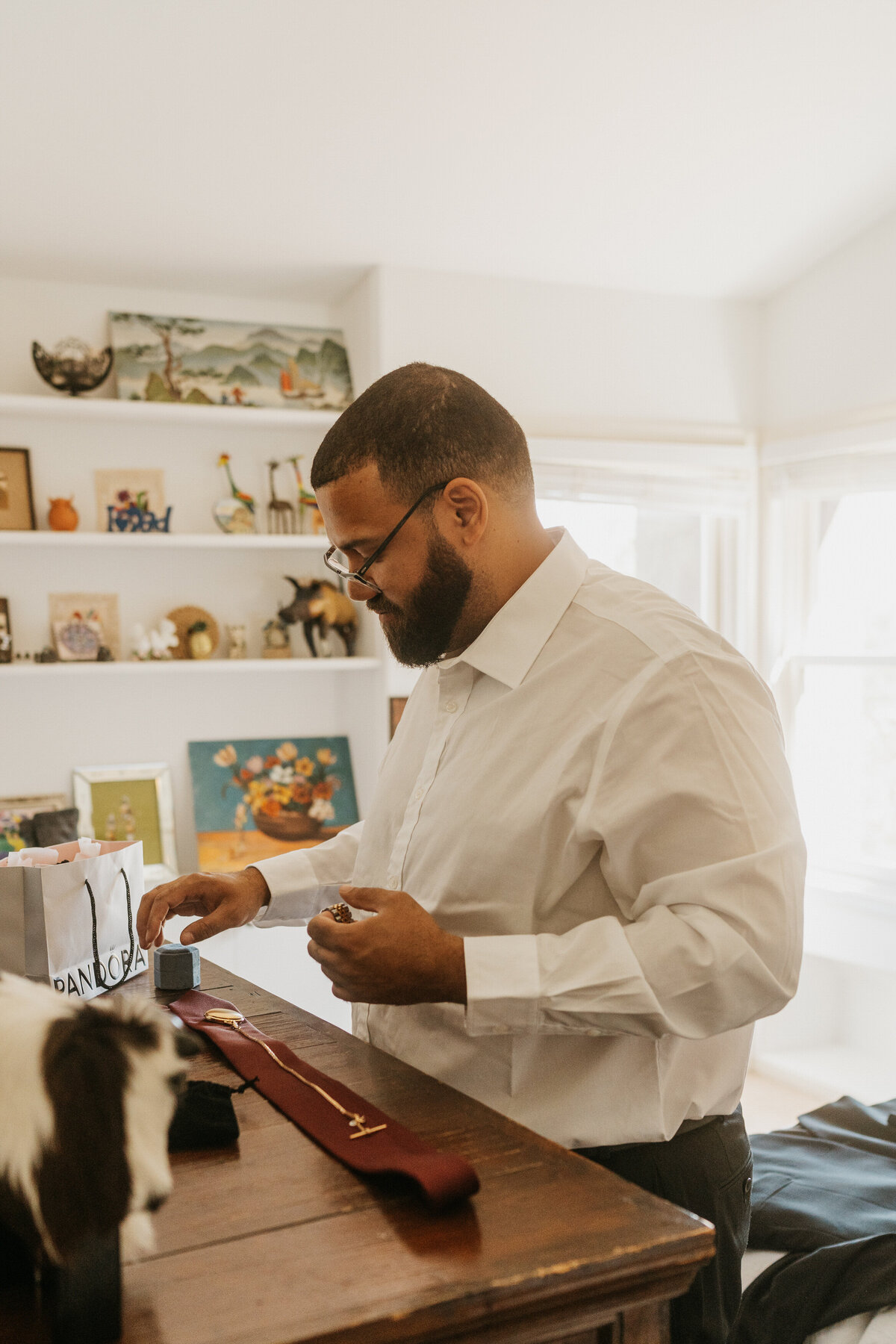 A person reaching down to put on accessories before their wedding 