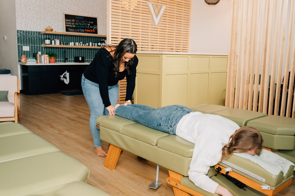 Branding image of therapist and patient in cozy clinic room, photographed by Lissette G