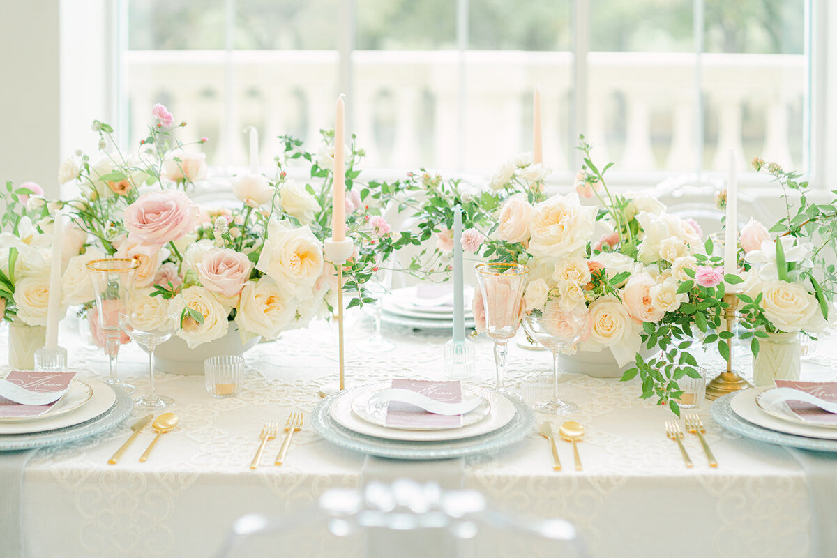 Pastel hued tabletop settings for luxury wedding reception