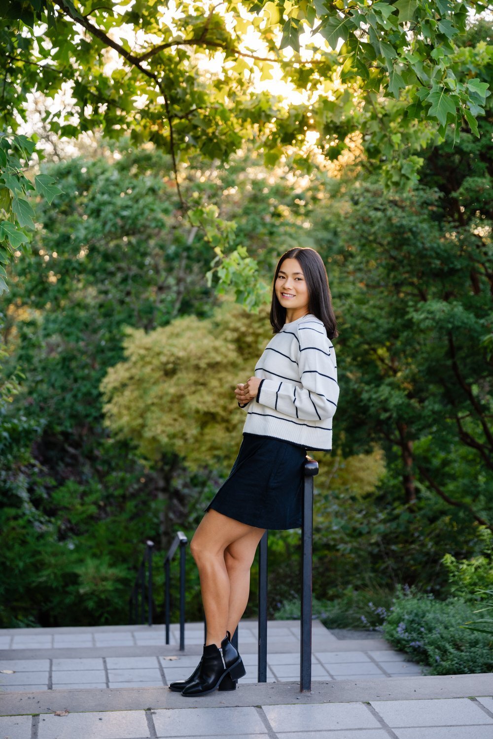 bellevue botanical garden senior leaning on rail with greenery