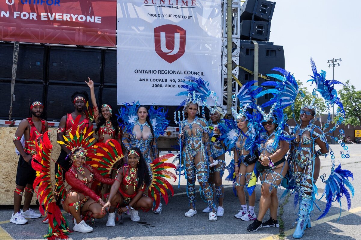 Toronto caribbean carnival parade masquerader in costume with Sunlime Mas, the number 1 medium size band at Toronto Carnival.