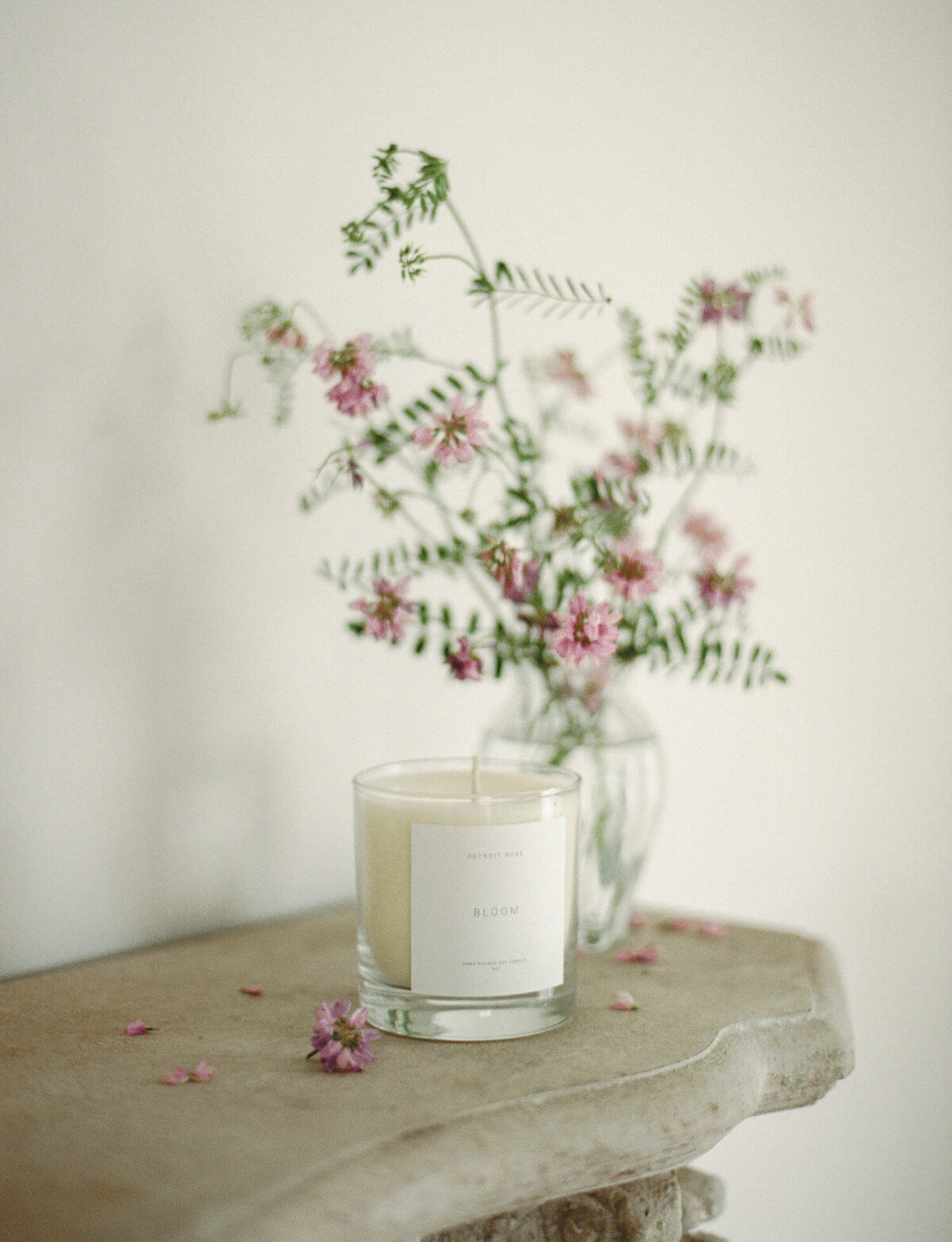 candle film branding photo, lifestyle film photo, candle on ornate mantle with wildflower bouquet