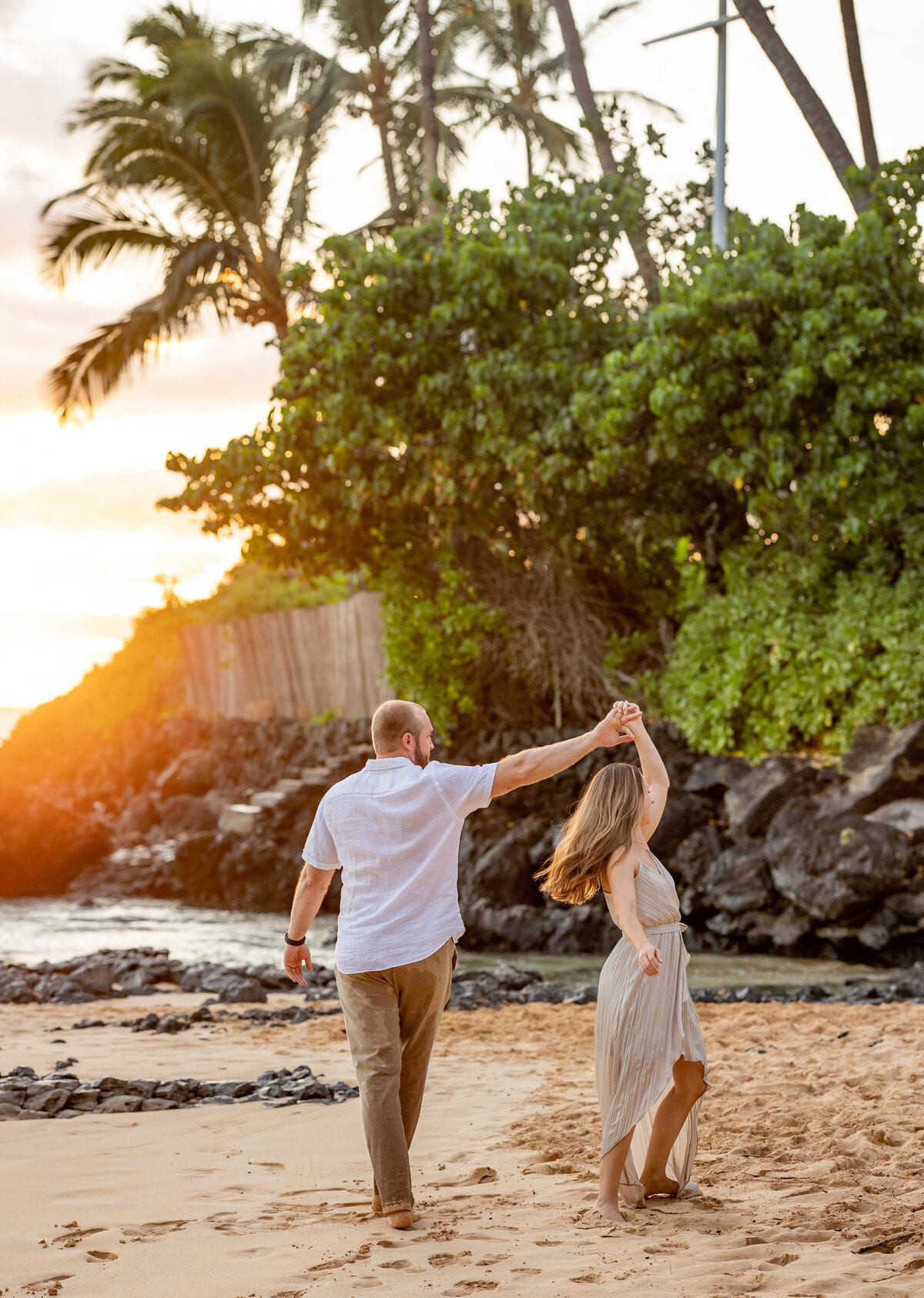 Hawaii Engagement Photographer captures couple dancing during beach engagement photos