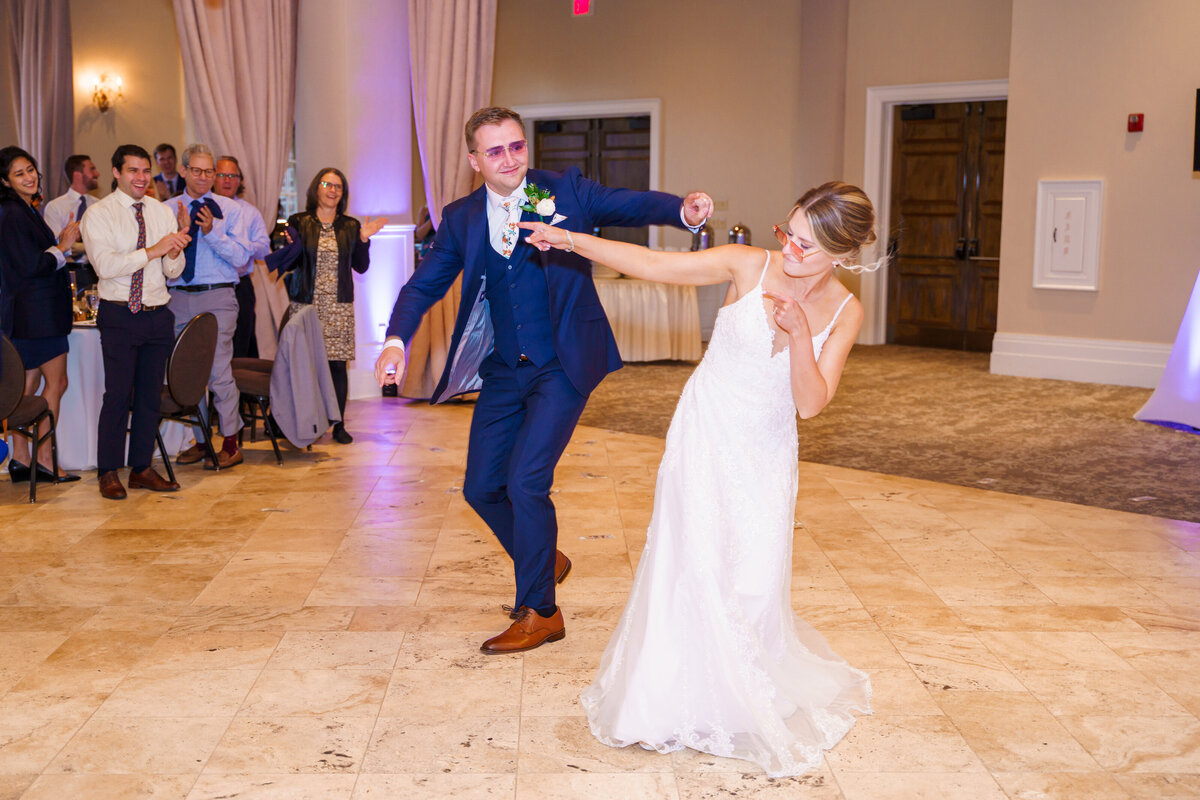 Bride and groom enter their reception wearing sunglasses and dancing at the Pinnacle Gold Club in Grove City, Ohio.