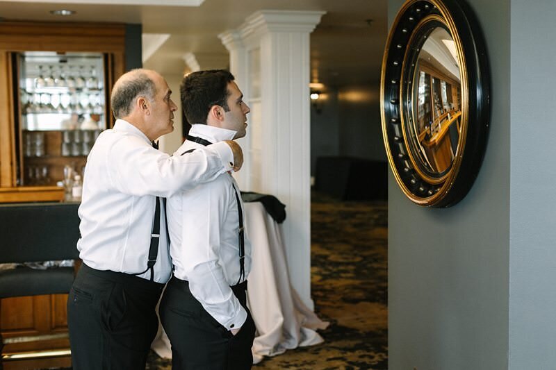 groom-buttoning-suit-jacket-evansville-country-club10