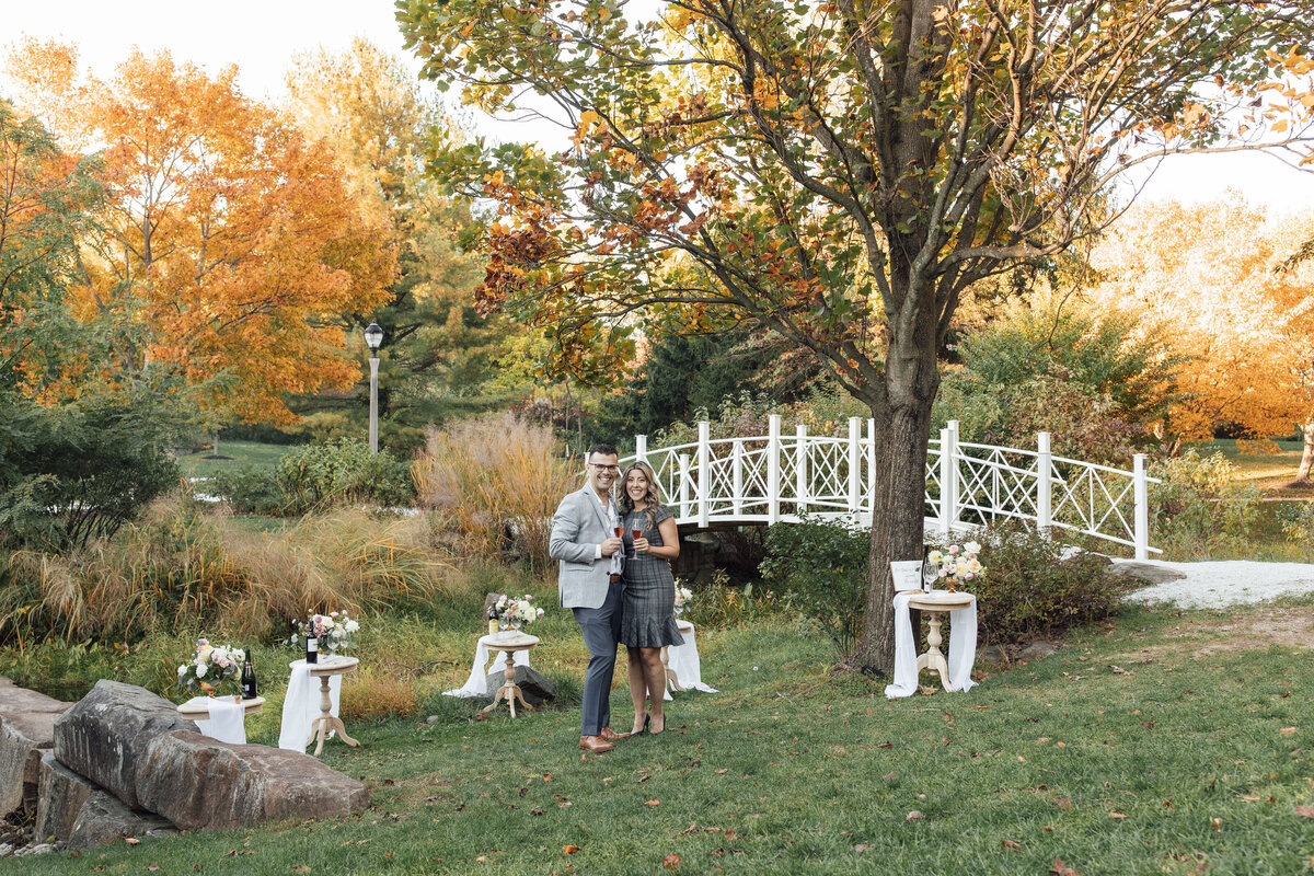 Proposal Photographer | Groom-to-be proposing in the gardens surrounded by flowers at Sayen House and Gardens | Hamilton Township, New Jersey