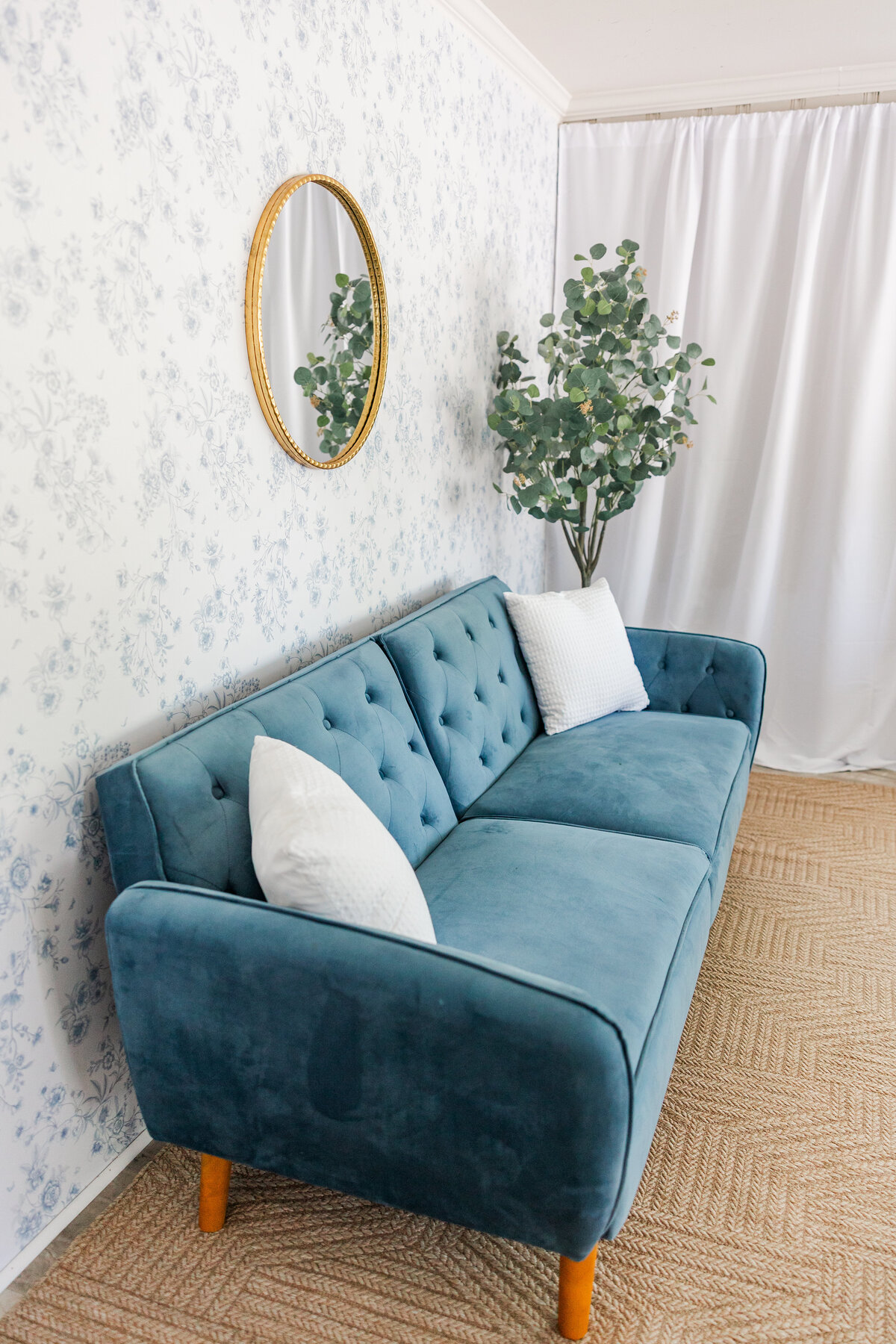Back Entry Way Blue Couch with Floral Wallpaper