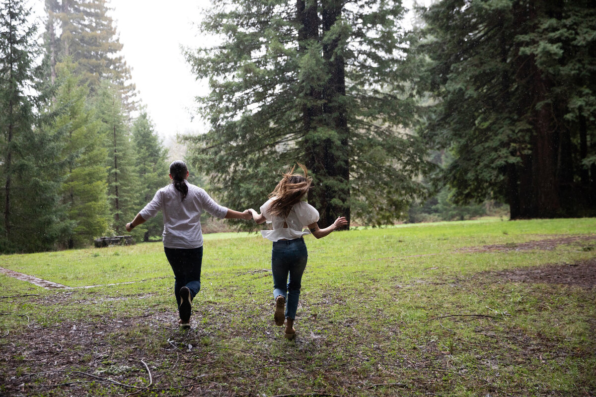 couple running in forest
