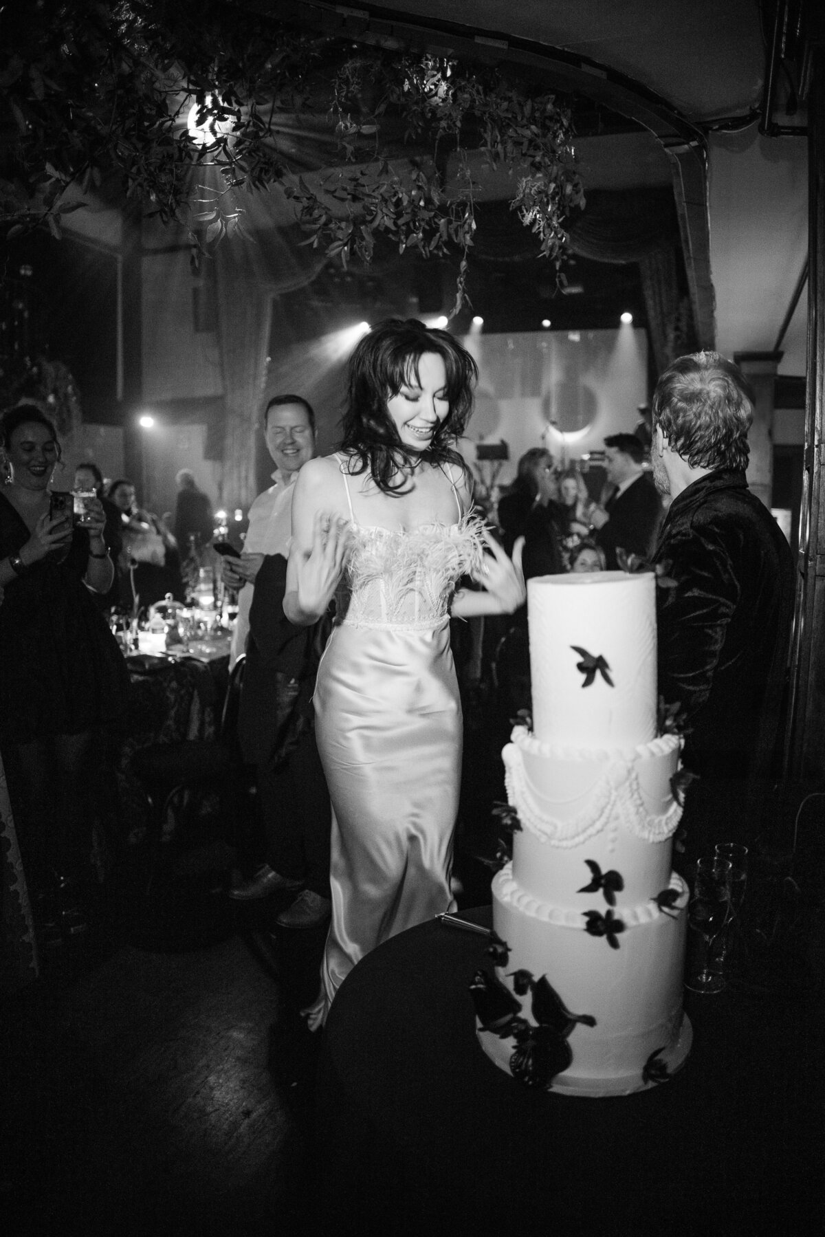 A bride and groom cut the cake at their nyc luxury wedding