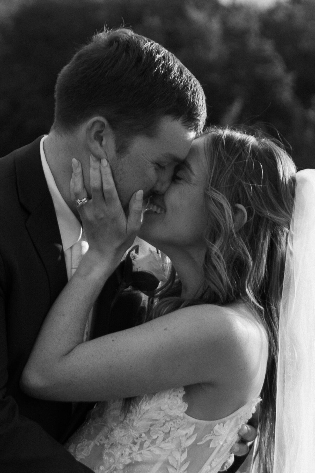 bride-and-groom-smiling-kiss-black-and-white