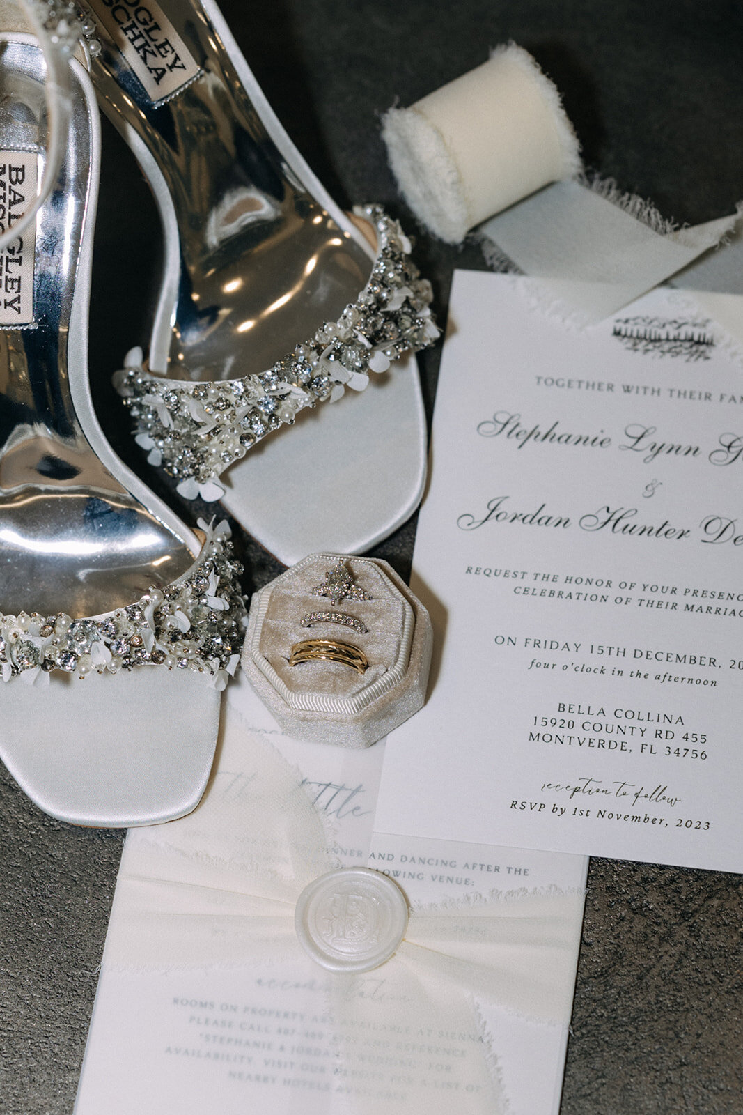 rings and invites at bella collina wedding venue​