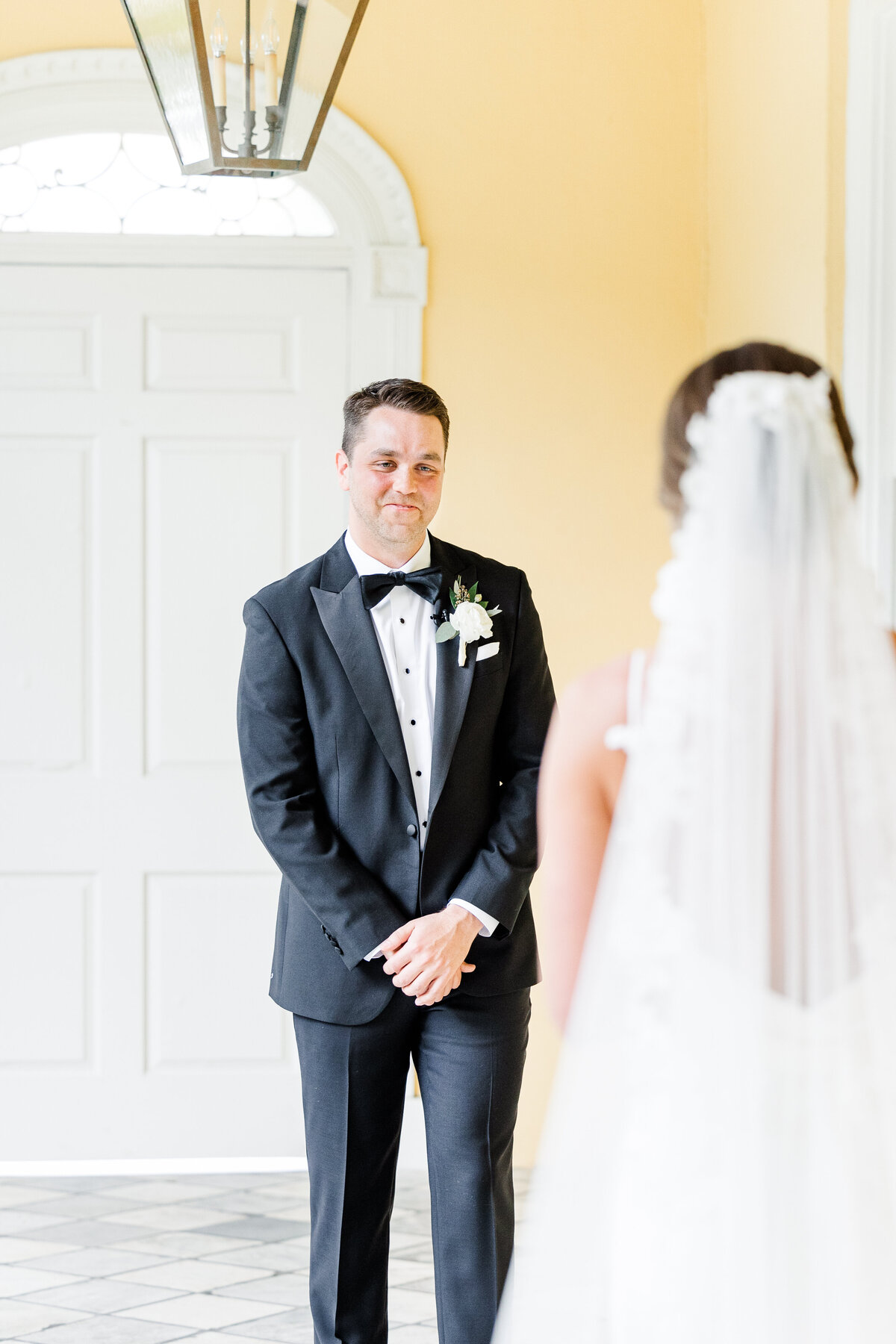 bride and groom first look at the william aiken house