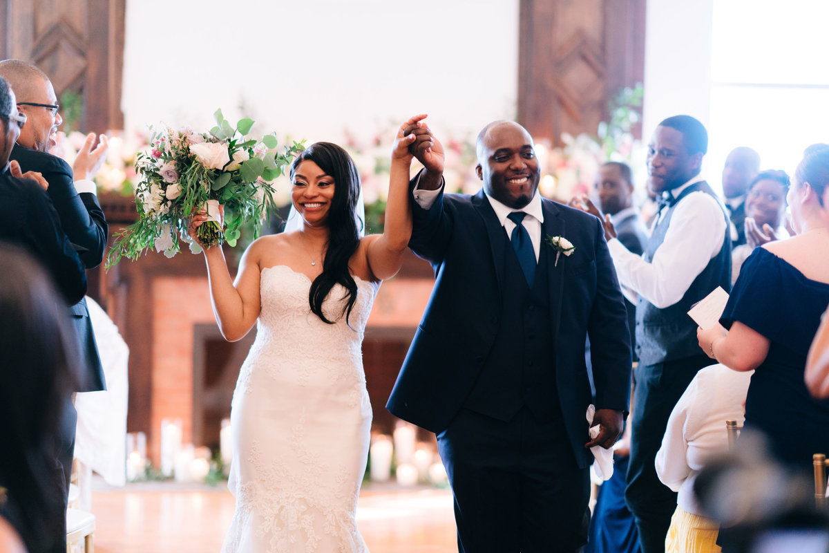 Bride and groom recessional after wedding ceremony