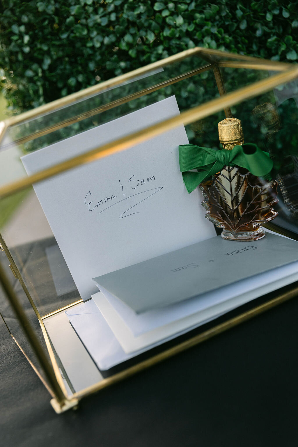 Glass card box with wedding cards for Emma and Sam at Arizona Biltmore wedding reception.