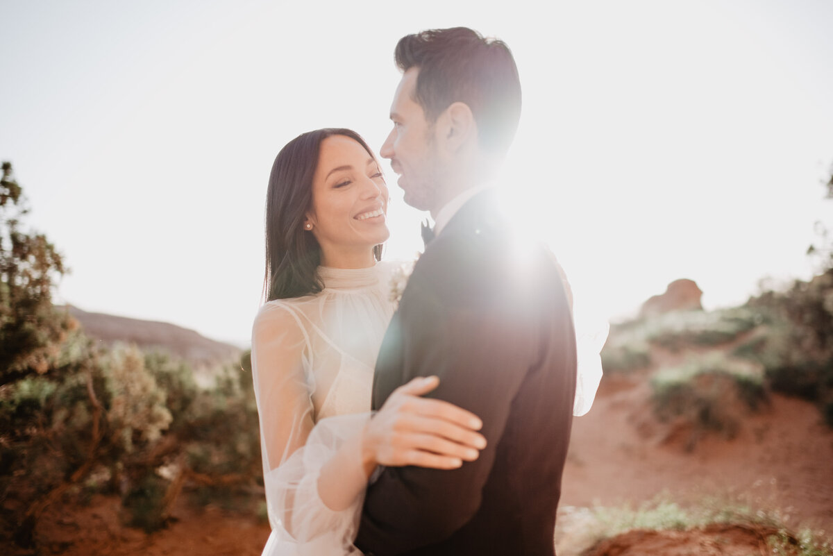 Utah elopement photographer captures bride looking at her groom