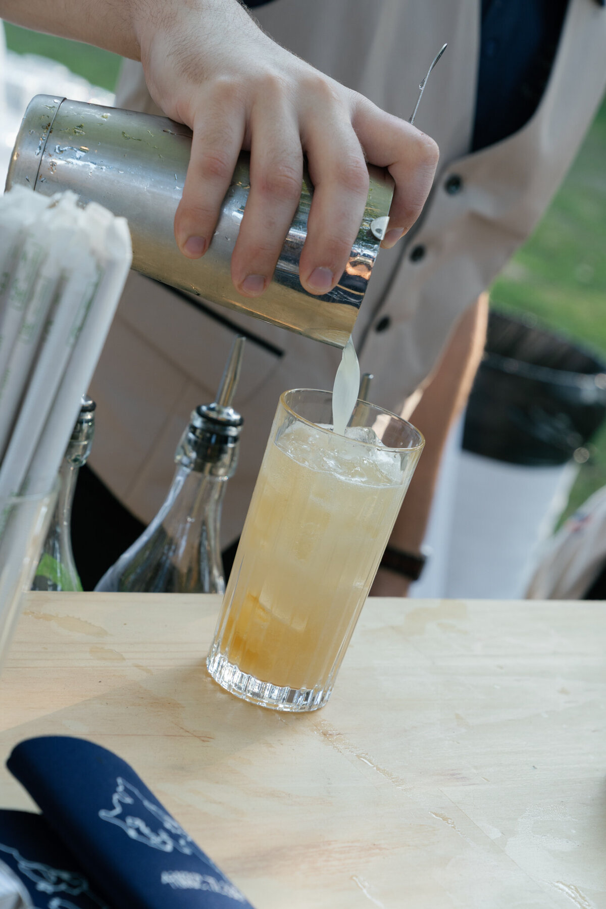 Candid photo of bartender making a drink taken by shelby ann photos film wedding photographer
