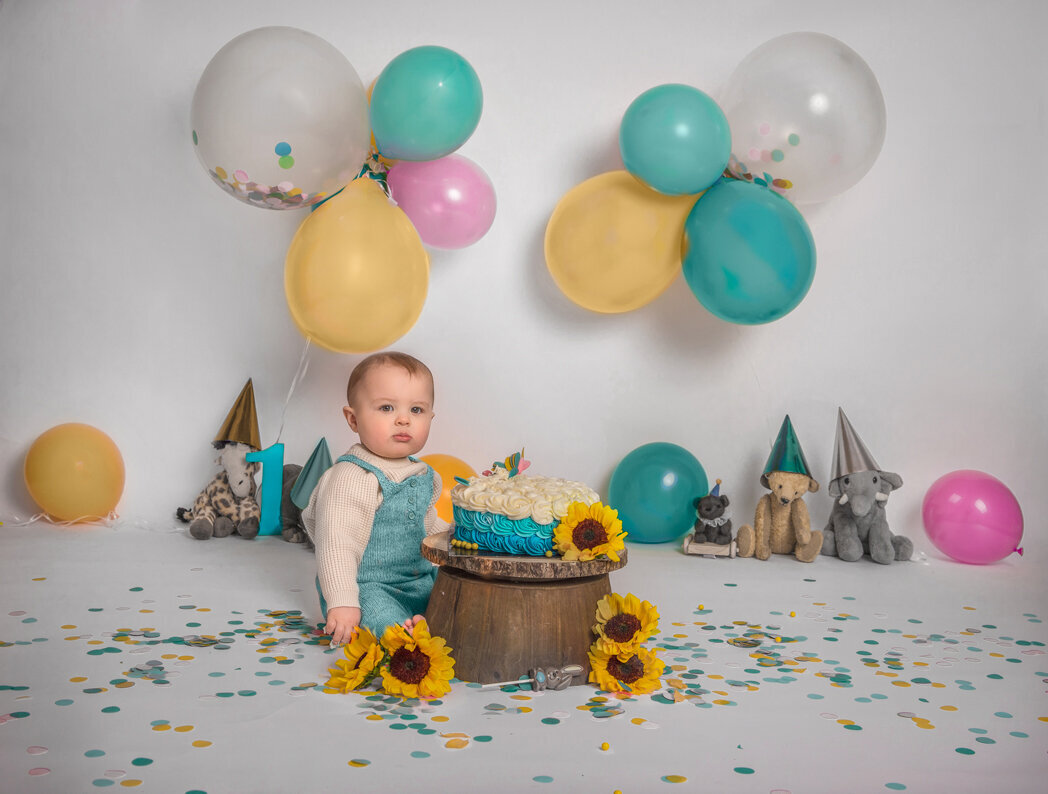Baby boy enjoying a blue-themed cake smash session for his first birthday – Sonia Gourlie FIne Art Photography in Ottawa