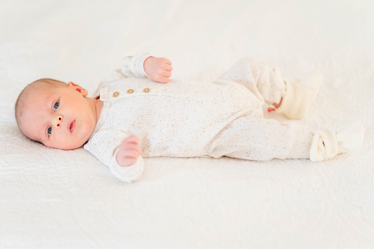 Newborn boy in crib taken in Sutton, MA 