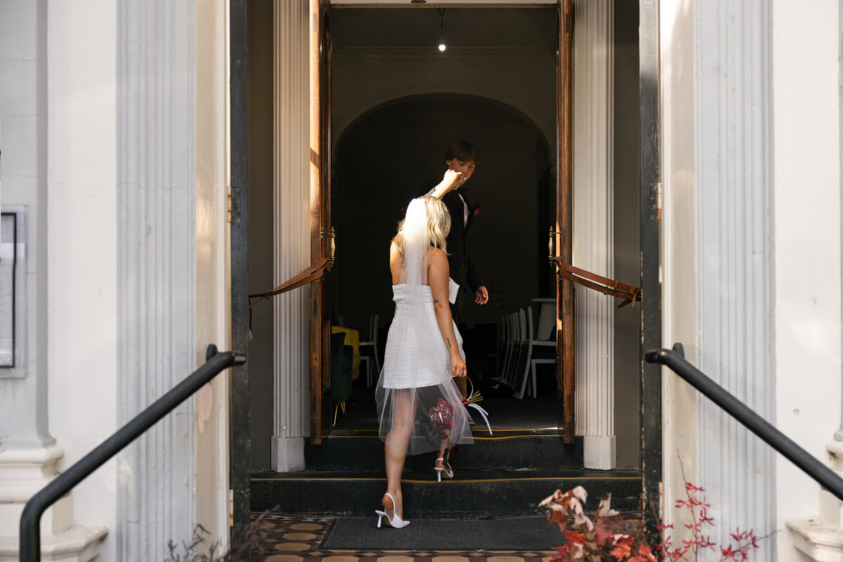 Bride and Groom entering their wedding venue reception