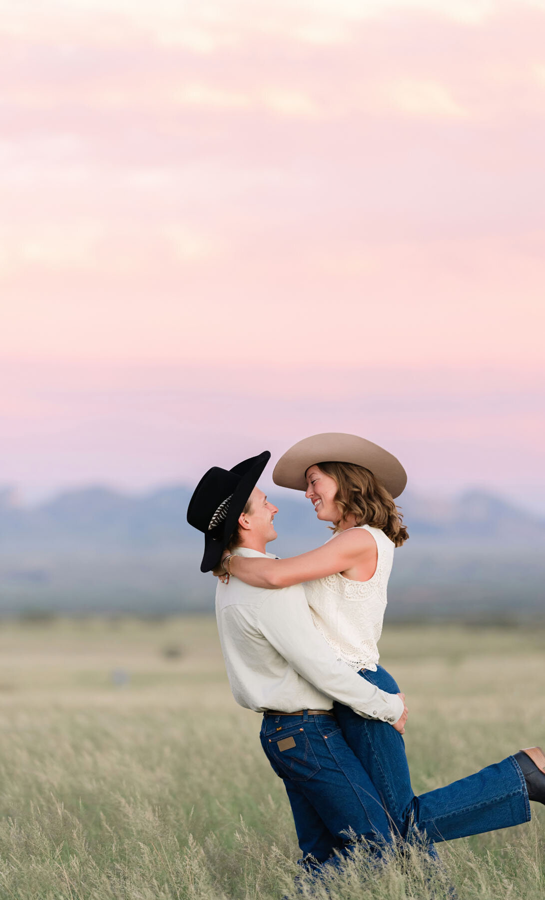 Arizona engagement photos with saguaros and desert grass