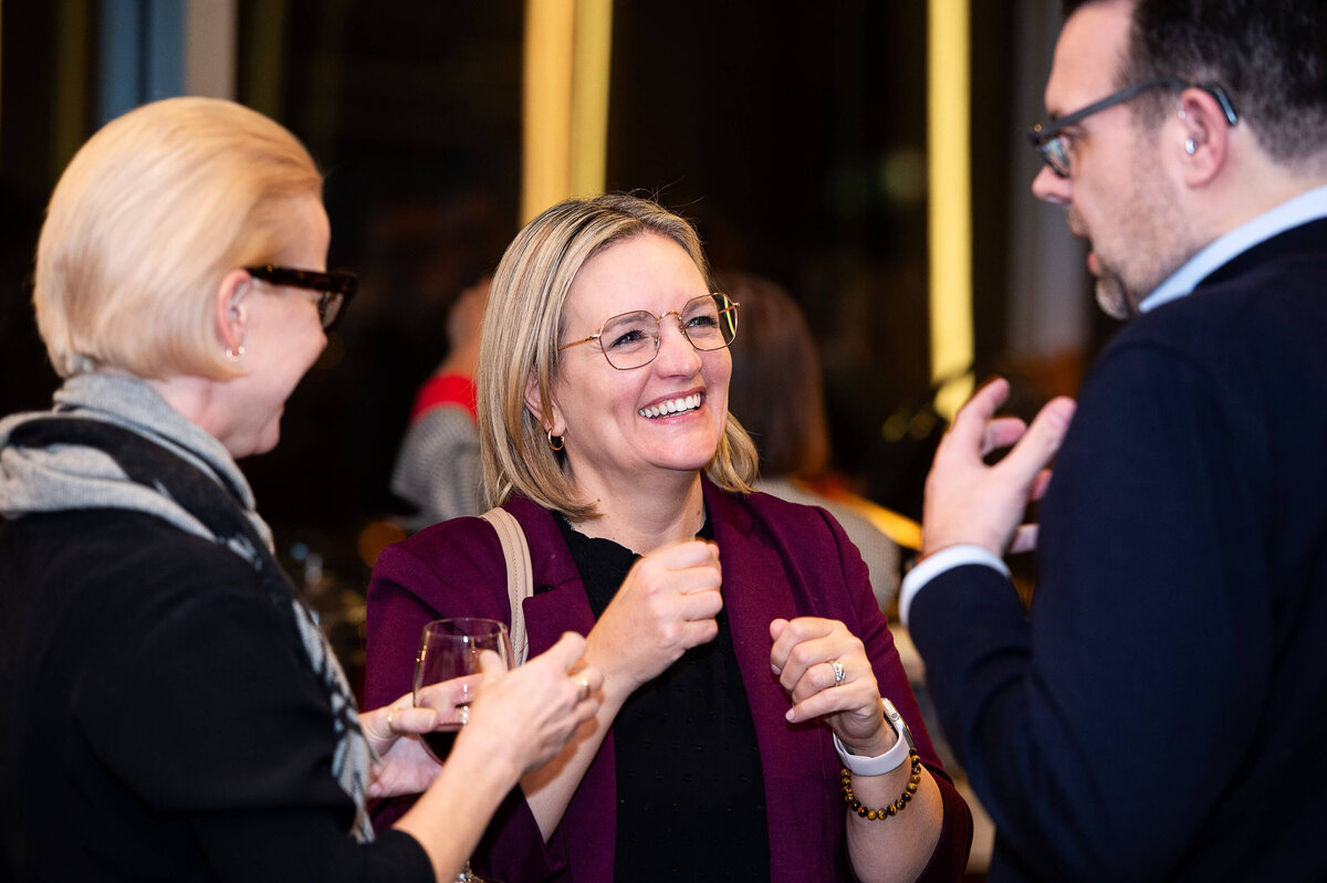 Ottawa event photos showing attendees smiling during a corporate reception.  Captured by JEMMAN Photography COMMERCIAL

