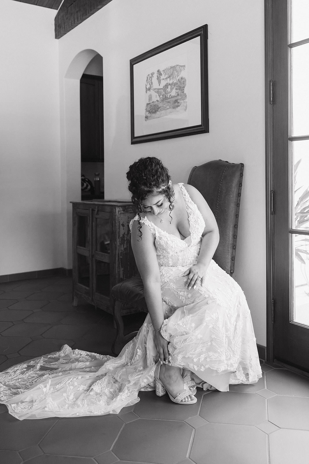 Bride getting into her dress