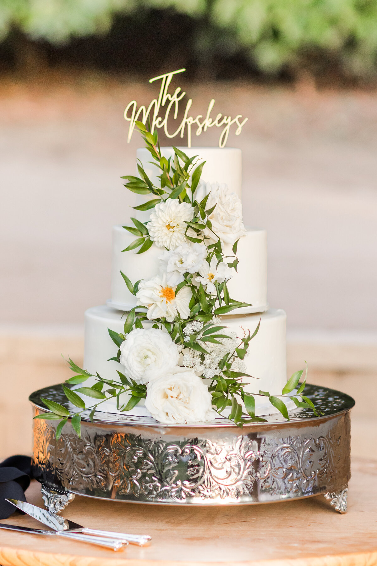 white wedding cake with white roses