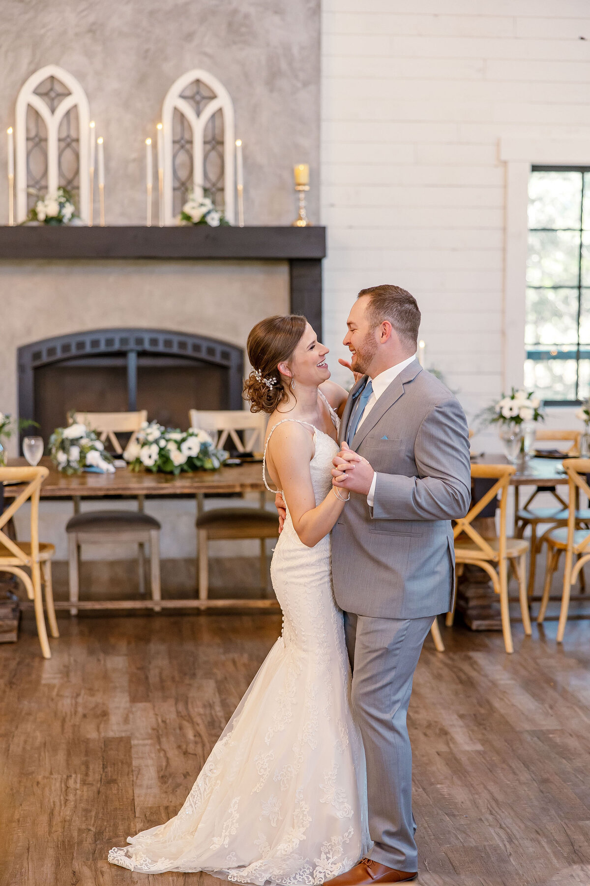 first wedding dance with fireplace on wall at wedding near Austin Texas