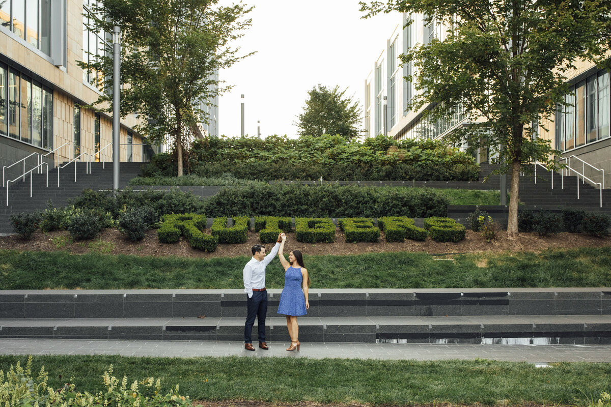 Couple dancing during summer pre-wedding photos at Rutgers University in New Brunswick New Jersey