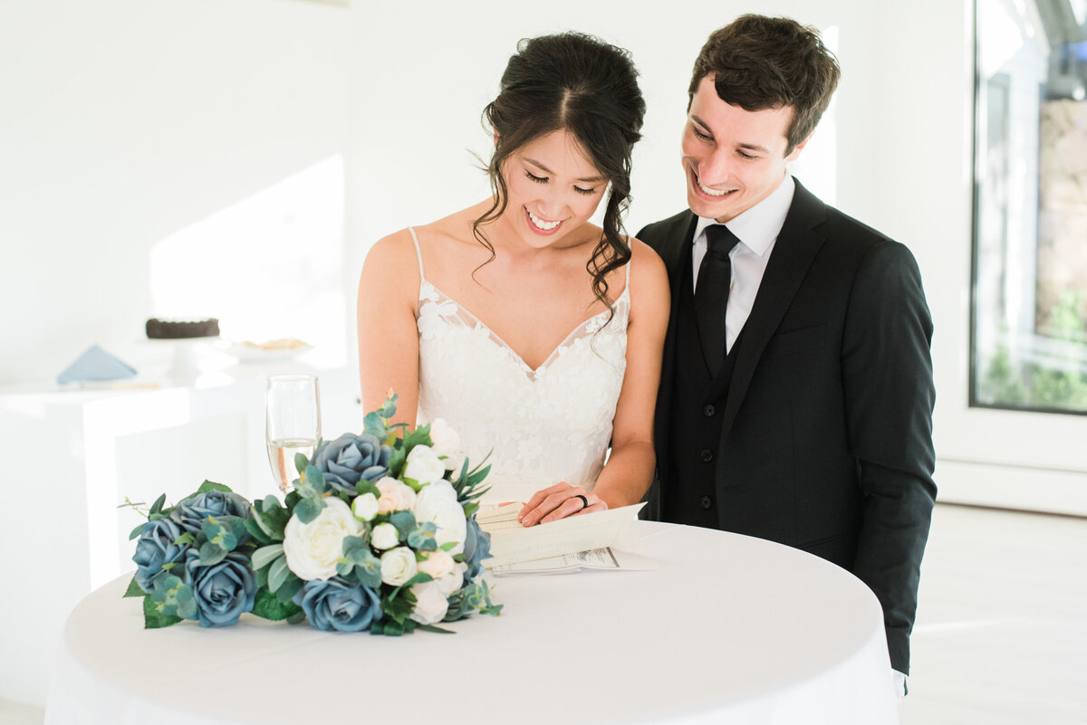 Bride signs the marriage license