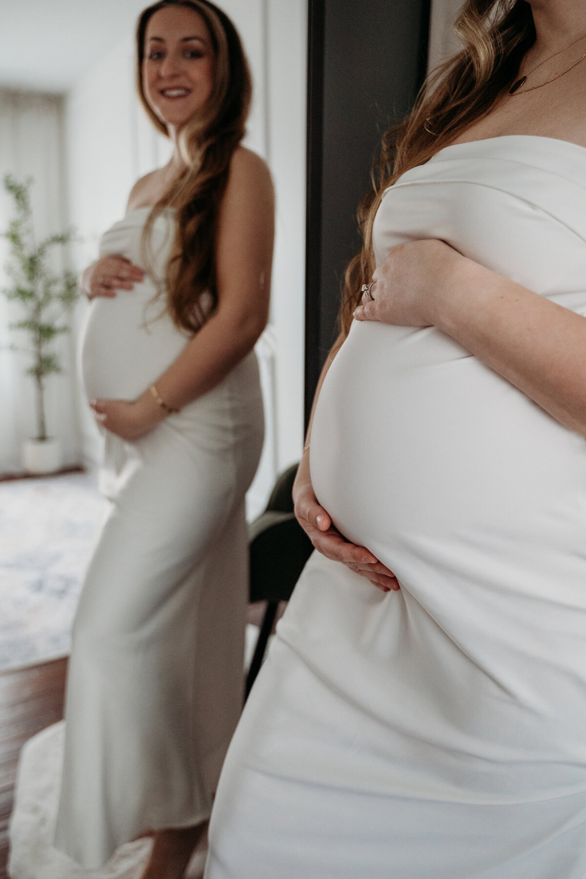 Reflection of pregnant mom in the mirror as she awaits her princess during a studio maternity photoshoot in Bartlett, IL